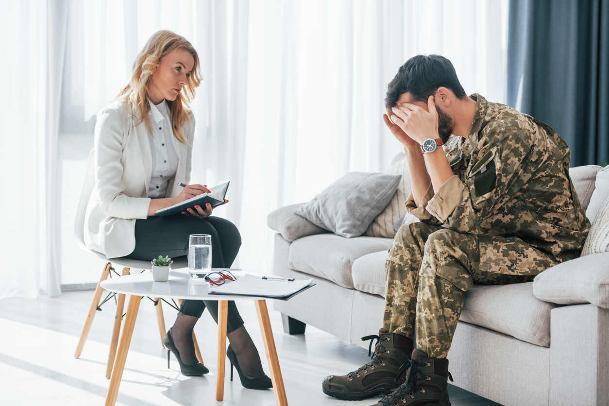 Person sitting next to a meditator and filing Military Divorce